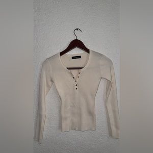 Cream colored long sleeve shirt from local shop